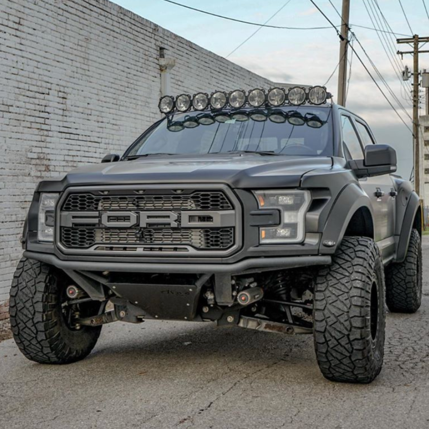 2017-2020 Ford Raptor with aftermarket fenders and off-road lights, showcasing rugged design and enhanced performance.