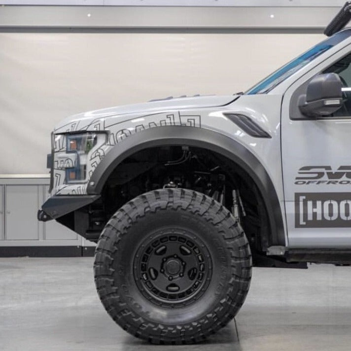 2017-2020 Ford Raptor fenders showcasing rugged design and off-road capability, mounted on a modified truck.