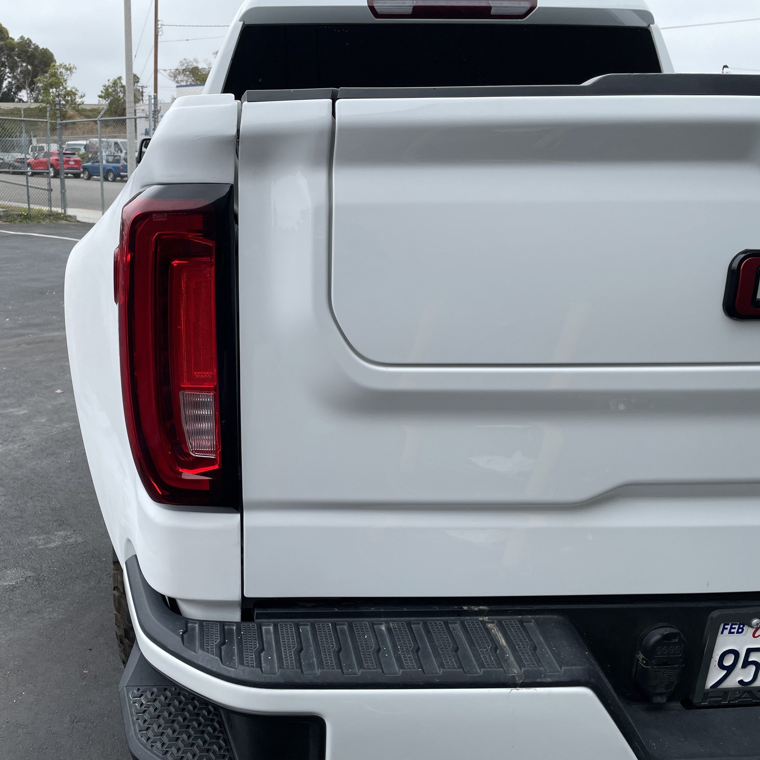 2019-2021 GMC Sierra truck bedside showing sleek design and integrated taillight, ideal for replacement or upgrade.