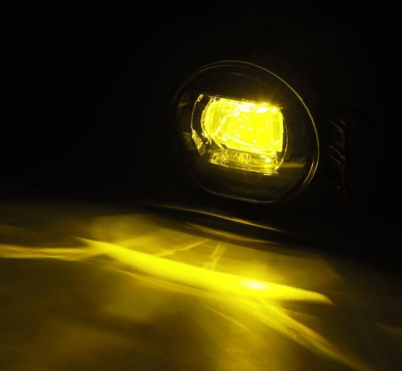 AlphaRex dual color LED fog light for 02-08 Dodge Ram 1500 and 03-09 Ram 2500/3500, showcasing bright yellow illumination.
