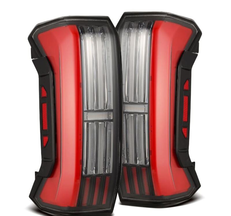 AlphaRex NOVA-Series prismatic LED tail lights for 22-24 Toyota Tundra in black and red, featuring a sleek design.