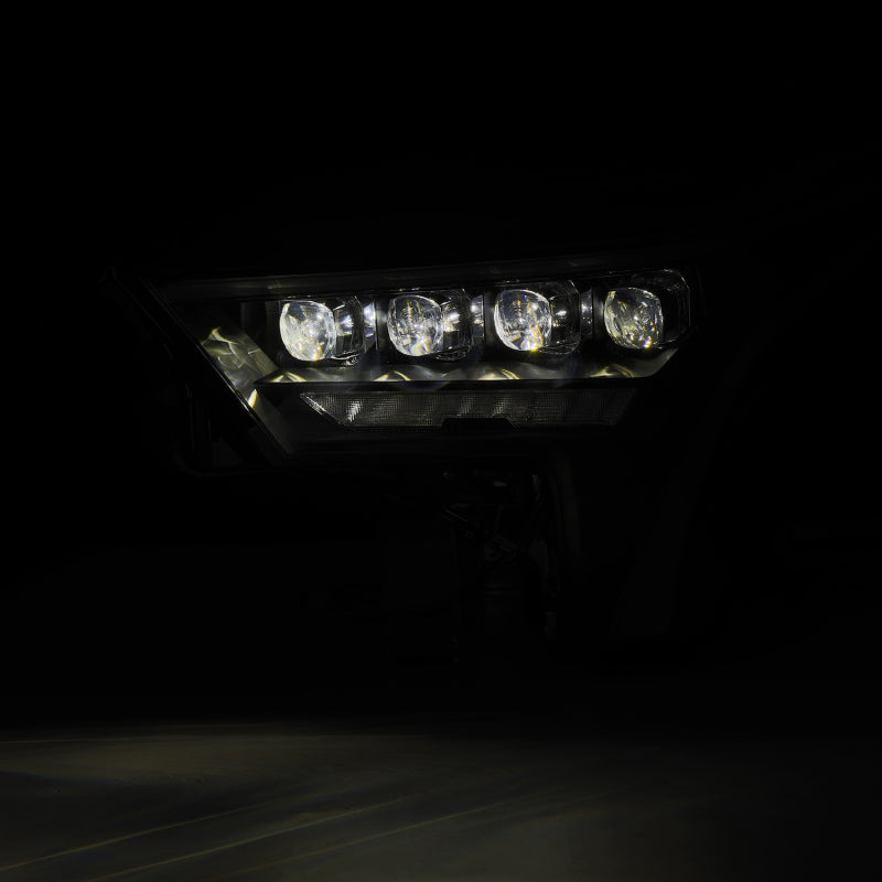 AlphaRex NOVA-Series black headlights for 22-23 Toyota Tundra featuring amber daytime running lights.
