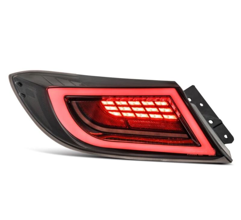 AlphaRex 22-24 Toyota GR86 LUXX LED taillight in black smoke with bright red LED illumination, enhancing vehicle visibility.