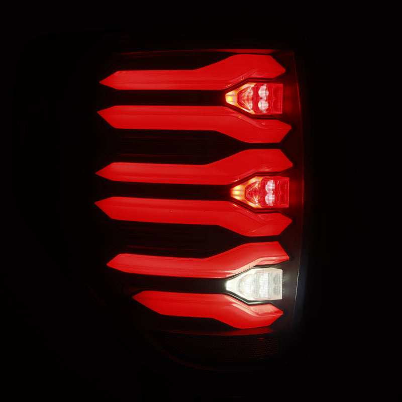 AlphaRex LUXX LED taillights for 09-14 Ford F150 with black housing, featuring a modern design and bright illumination.