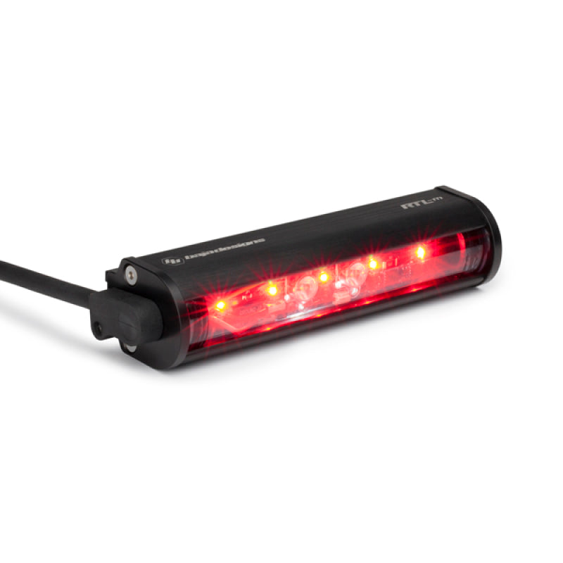 Baja Designs RTL-M No Plate Light 6in light bar with red LED lights in a sleek black housing, designed for offroad vehicles.