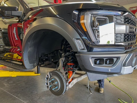 2021 and newer Raptor front leveling kit installation showing a 2-inch lift with upgraded suspension components.