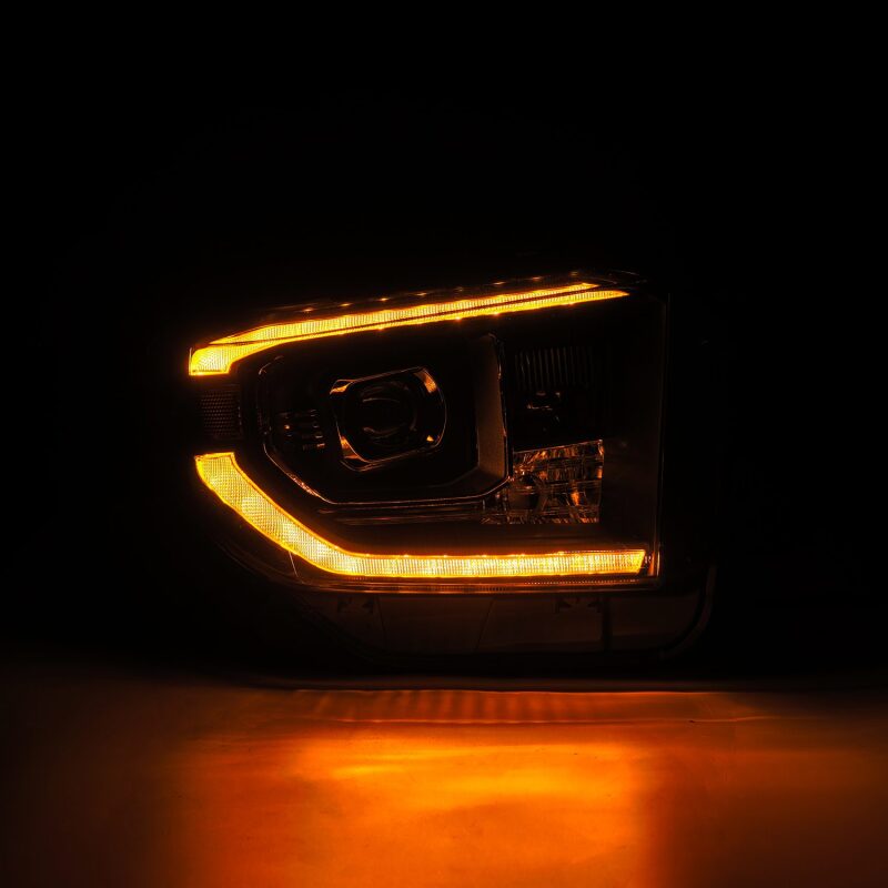 AlphaRex LUXX-Series LED projector headlights for 14-21 Toyota Tundra with black housing, active light, and sequential signal.