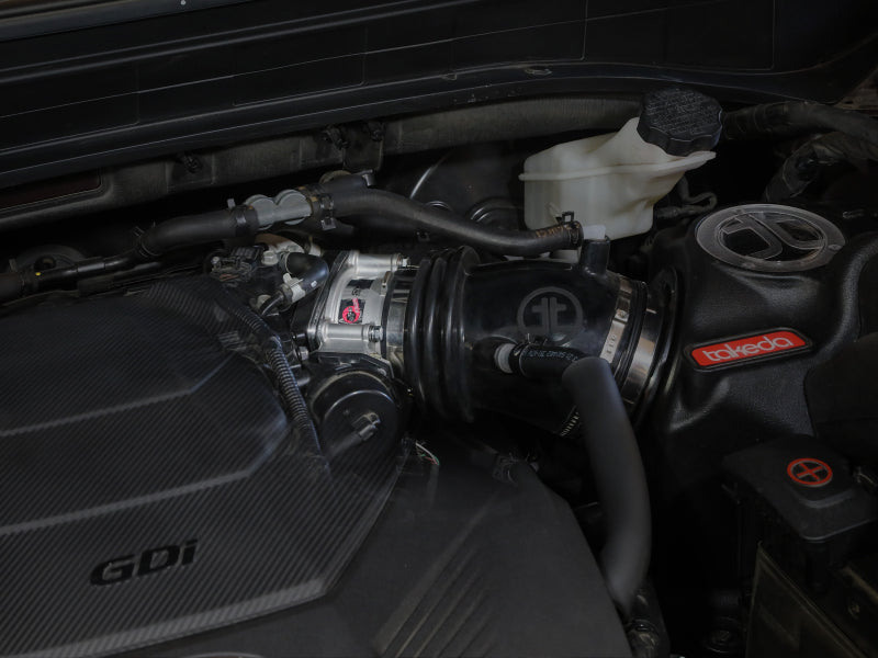 Throttle body spacer installed on a Hyundai Palisade engine, enhancing airflow for improved performance.