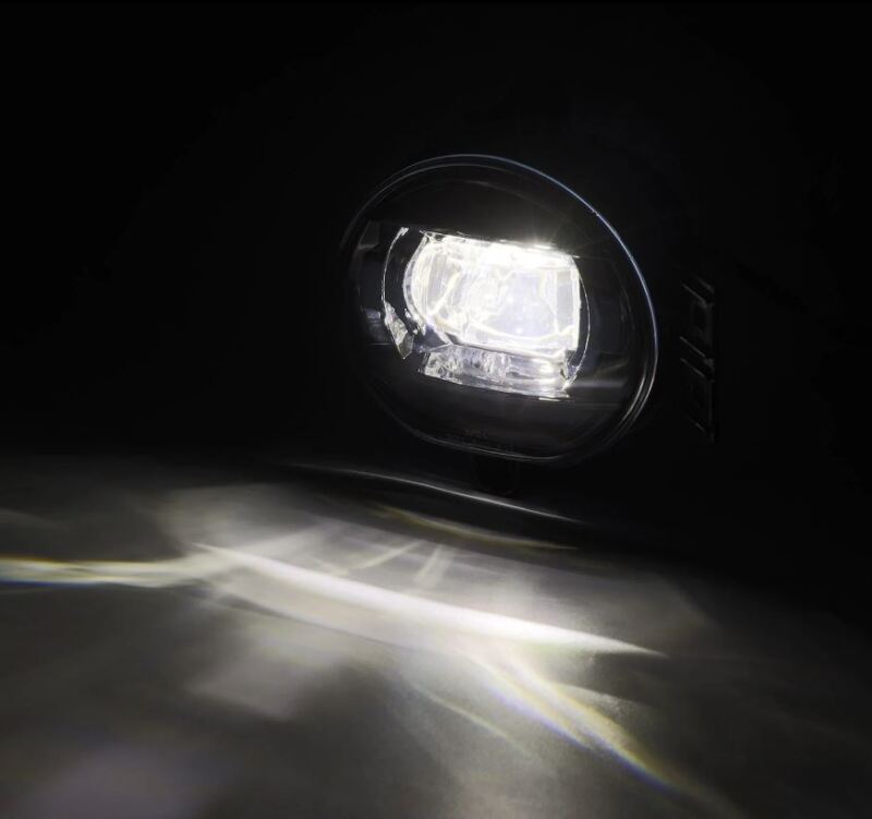AlphaRex Dual Color LED fog light for 02-08 Dodge Ram 1500 and 03-09 Ram 2500/3500, showcasing bright white and amber illumination.