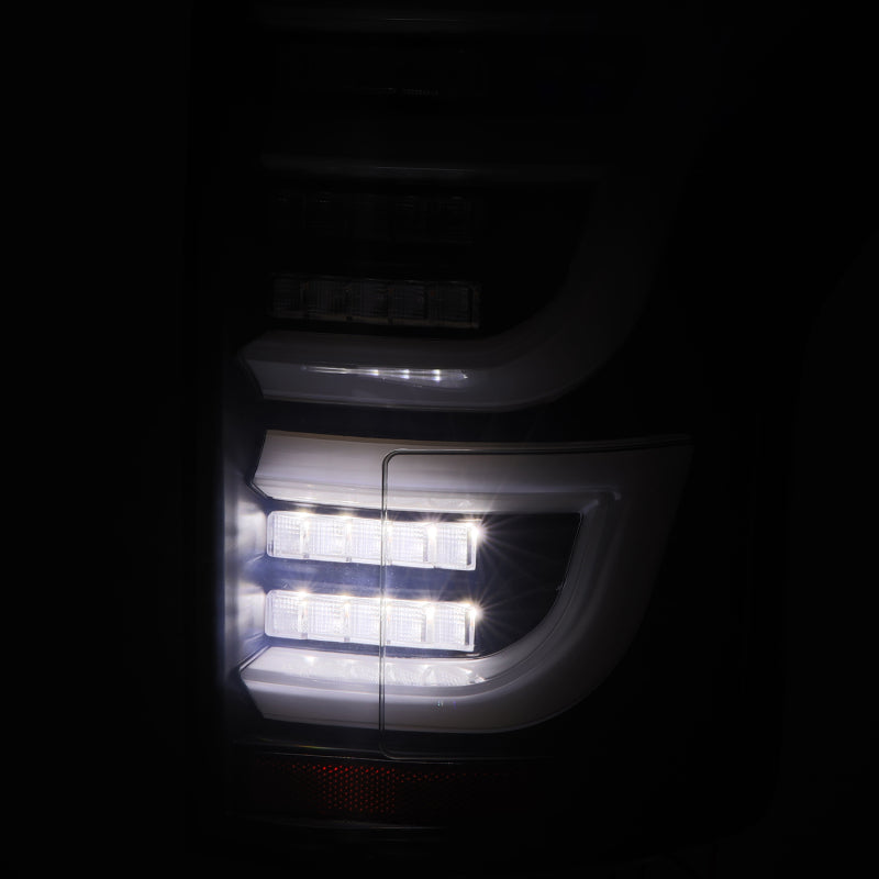 AlphaRex Luxx-Series LED tail lights for 2015-2020 Ford F150 in Alpha-Black, featuring a sleek design and bright illumination.