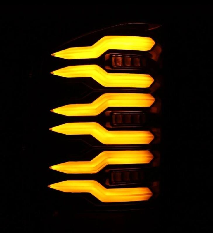 AlphaRex LUXX-Series LED tail lights for 2007-2013 Chevrolet Silverado 1500 with a sleek black finish and bright amber illumination.