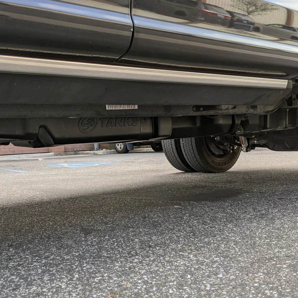 68-gallon replacement fuel tank installed under a 2017-2025 Ford F-250/F-350/F-450 Powerstroke 6.7L Crew Cab Long Bed.