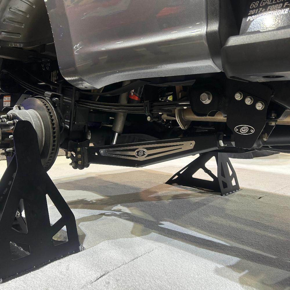 3.5-5.5 inch lift kit installed on a 2023 F250/F350, showcasing suspension components and support stands.