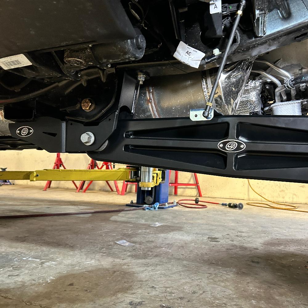 2.5-inch fully loaded suspension kit installed on a 2023 Ford F250/F350, showcasing components and undercarriage details.