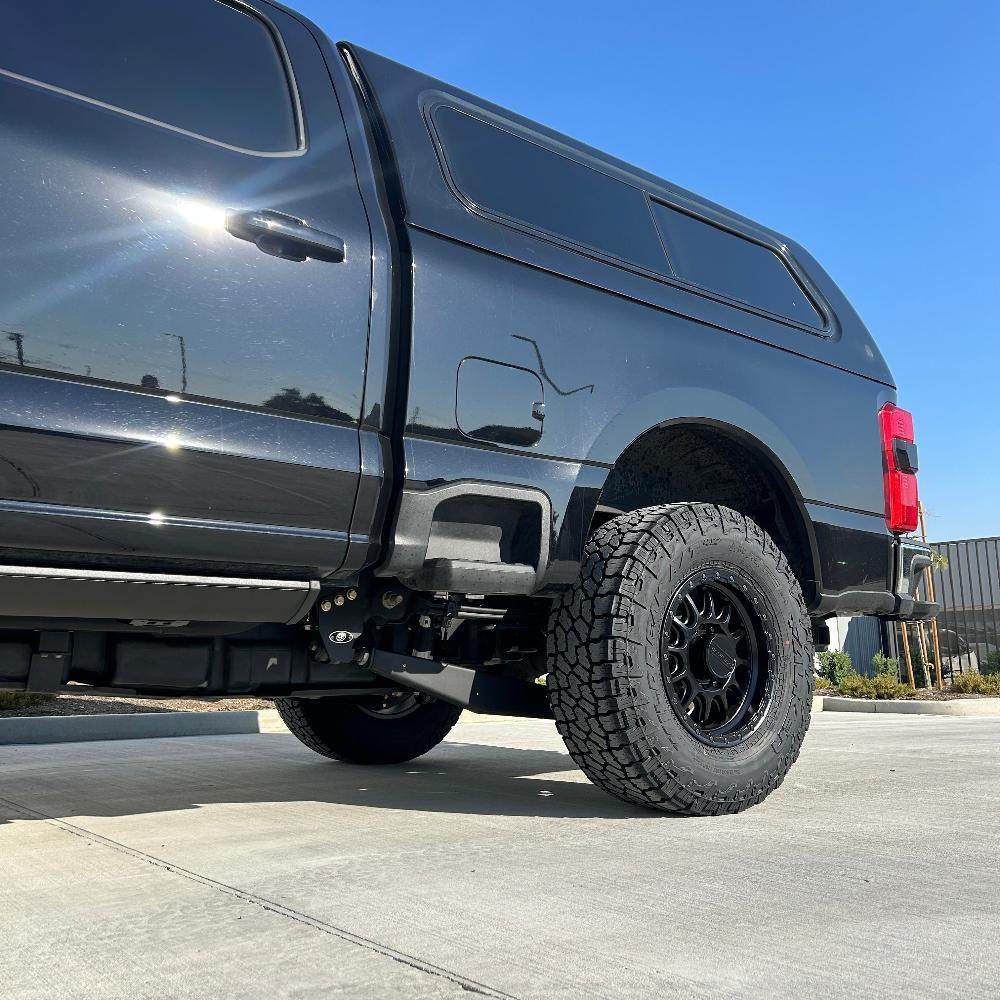2.5-inch standard lift kit installed on a 2023 Ford F250, showcasing enhanced suspension and rugged tires for offroad performance.