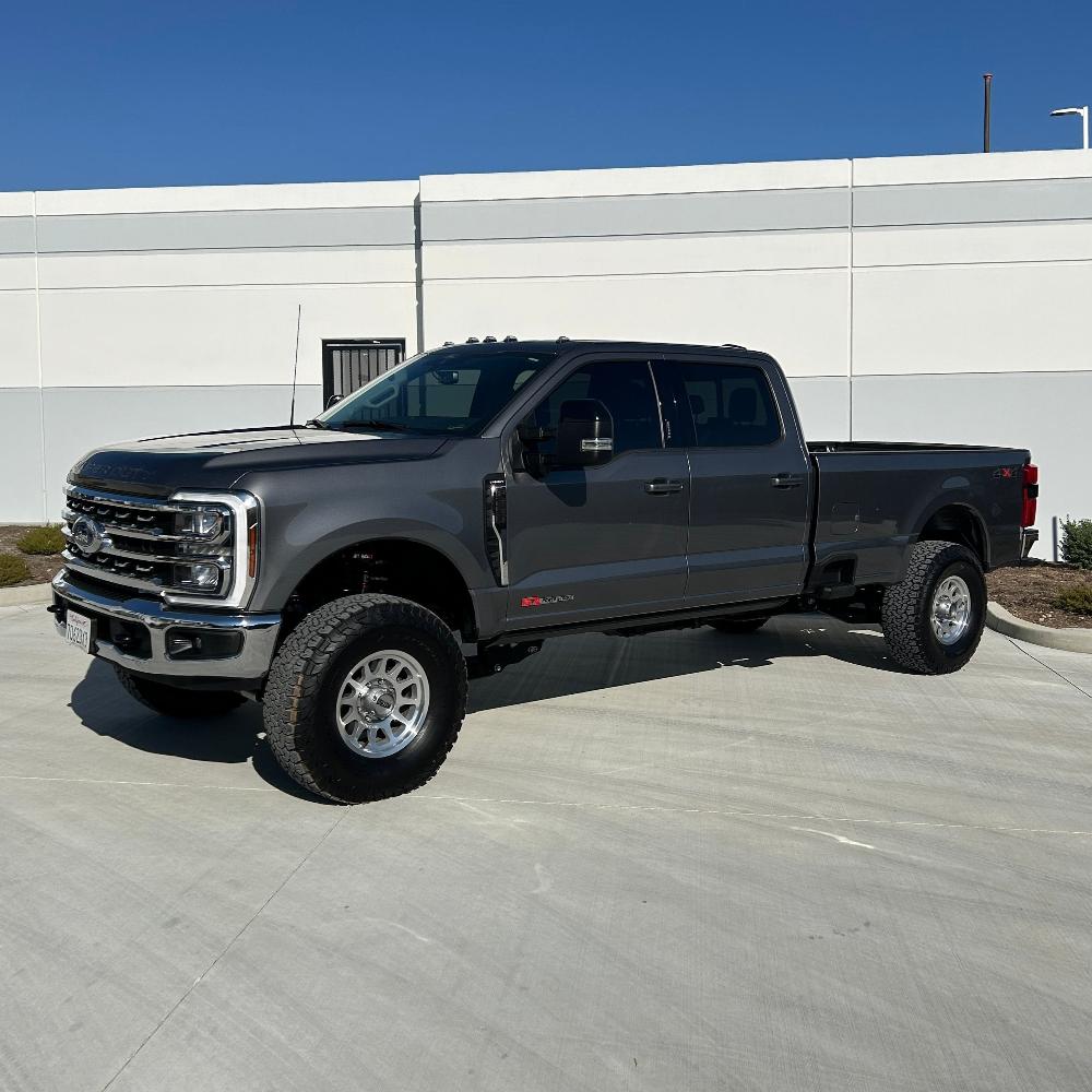 3.5-5.5" lift kit for 2023+ F250/F350 installed on a gray Ford truck, showcasing enhanced off-road capabilities.