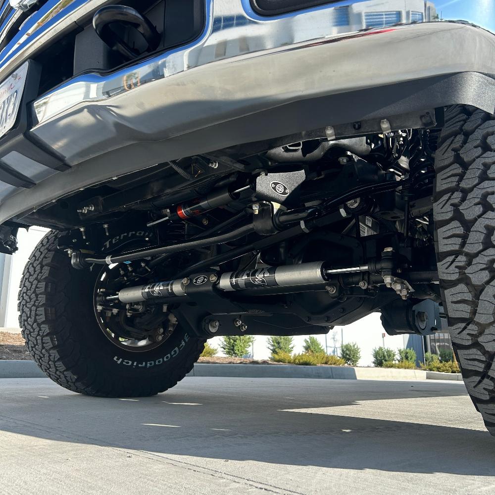 3.5-5.5 inch lift kit installed on a 2023 Ford F250/F350 showcasing enhanced suspension and undercarriage components.