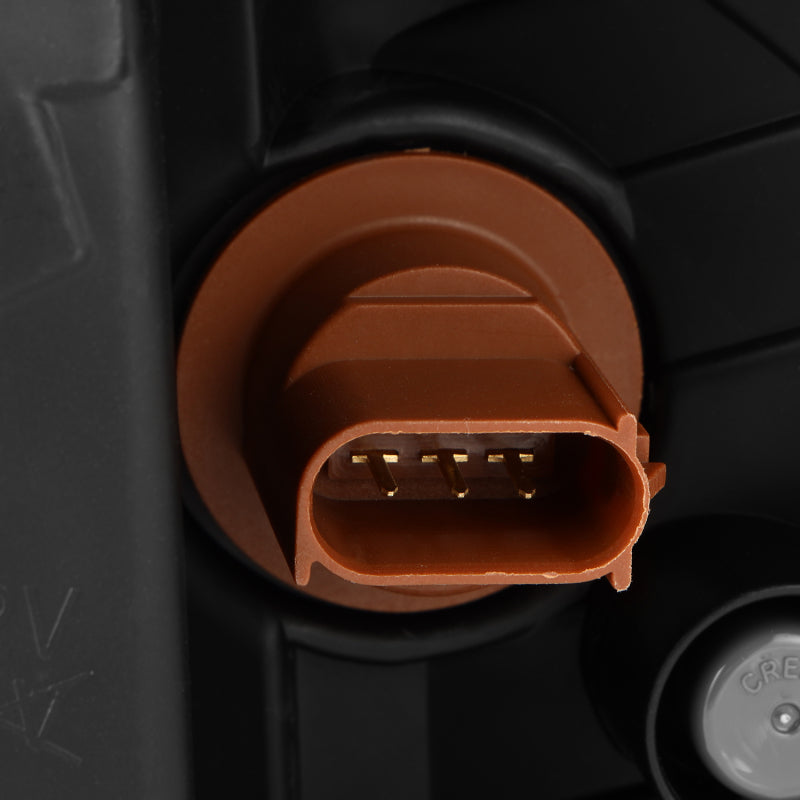 Close-up of the connector for AlphaRex projector headlights designed for 20-22 Ford F150, showcasing quality construction.