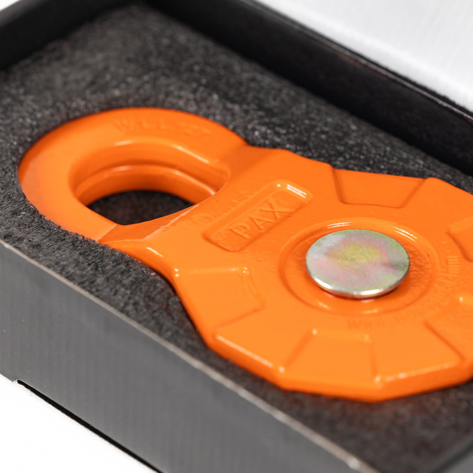12 Ton Forged Snatch Block in packaging, featuring an orange body and a metal pin for secure rigging and towing.