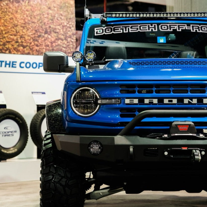 2021-2025 Ford Bronco with Sasquatch flares showcasing rugged design and off-road capabilities in a vibrant blue color.