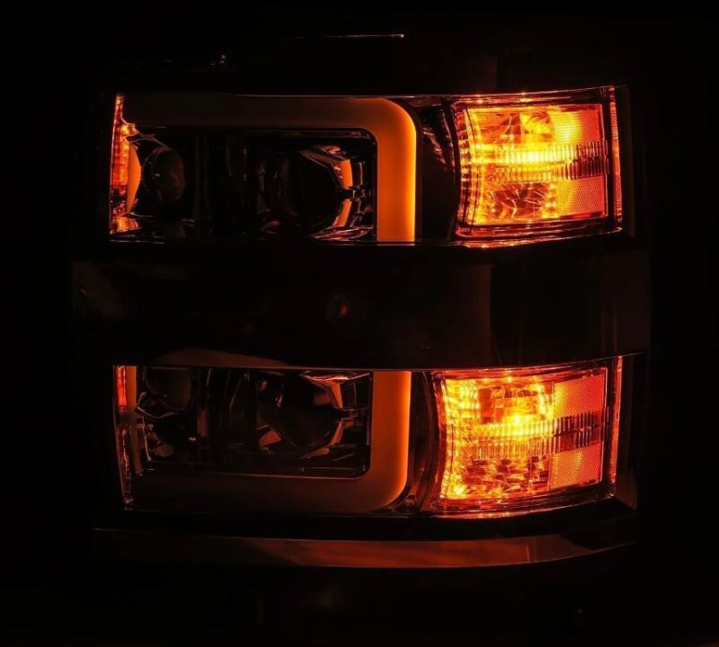 AlphaRex LUXX-Series projector headlights for 15-19 Chevy Silverado 2500/3500 with black housing and sequential signals.