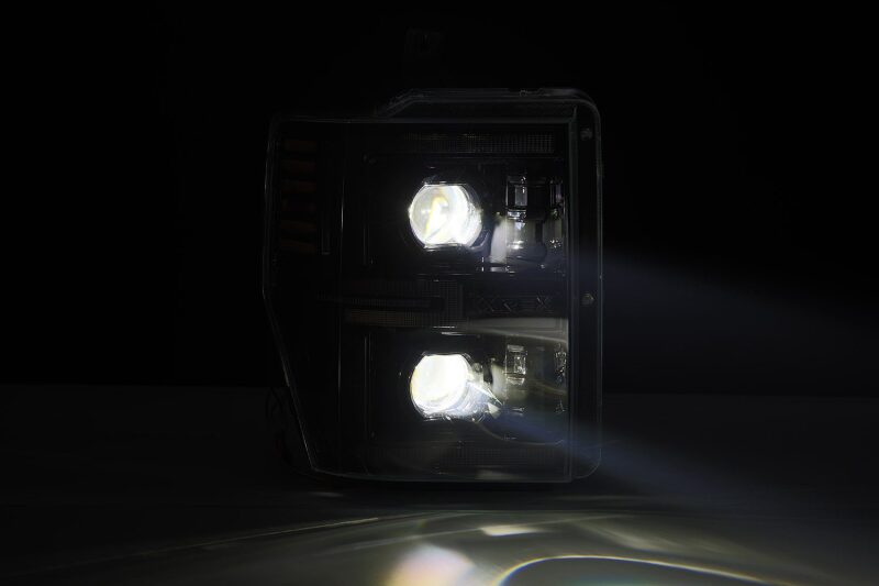 AlphaRex LUXX-Series LED projector headlights for 08-10 Ford F250-550 in black with sequential signal lights.