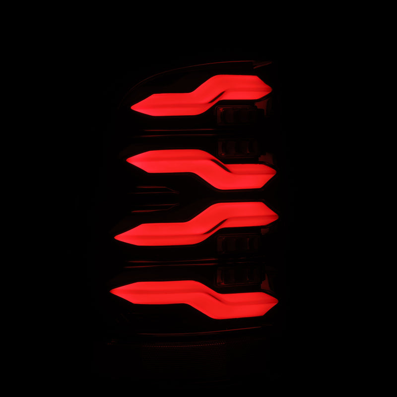 AlphaRex Luxx-Series LED tail lights for 09-18 Dodge Ram featuring a black finish, activation light, and sequential signal design.