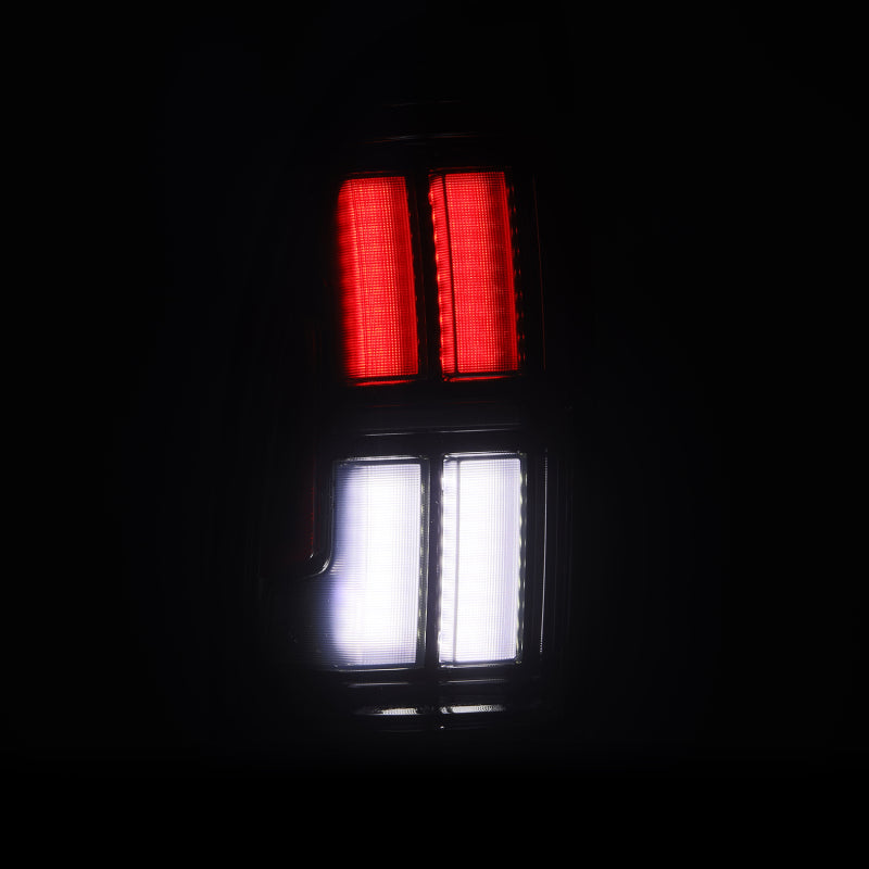 AlphaRex NOVA Prismatic LED tail lights for 05-15 Toyota Tacoma in alpha-black, showcasing red and white lighting.