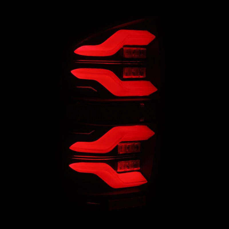 AlphaRex LUXX LED taillights for 16-21 Toyota Tacoma in black, featuring sequential signals and active lighting.