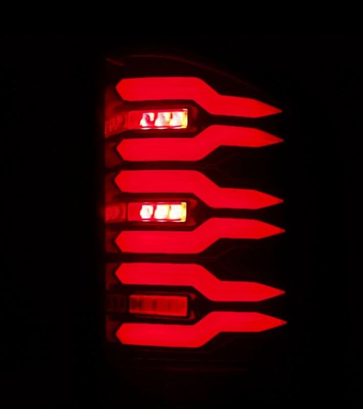 AlphaRex Luxx-Series LED tail lights for 2007-2014 Chevrolet Silverado in black and red design, showcasing bright illumination.