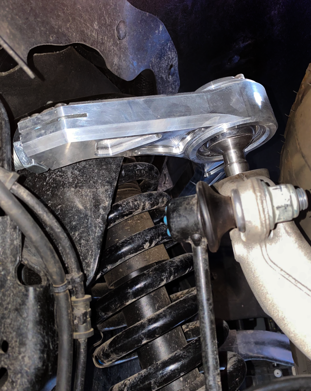 Billet upper control arm kit for 2015-2024 Ford F-150, showcasing stock length installation with detailed components.