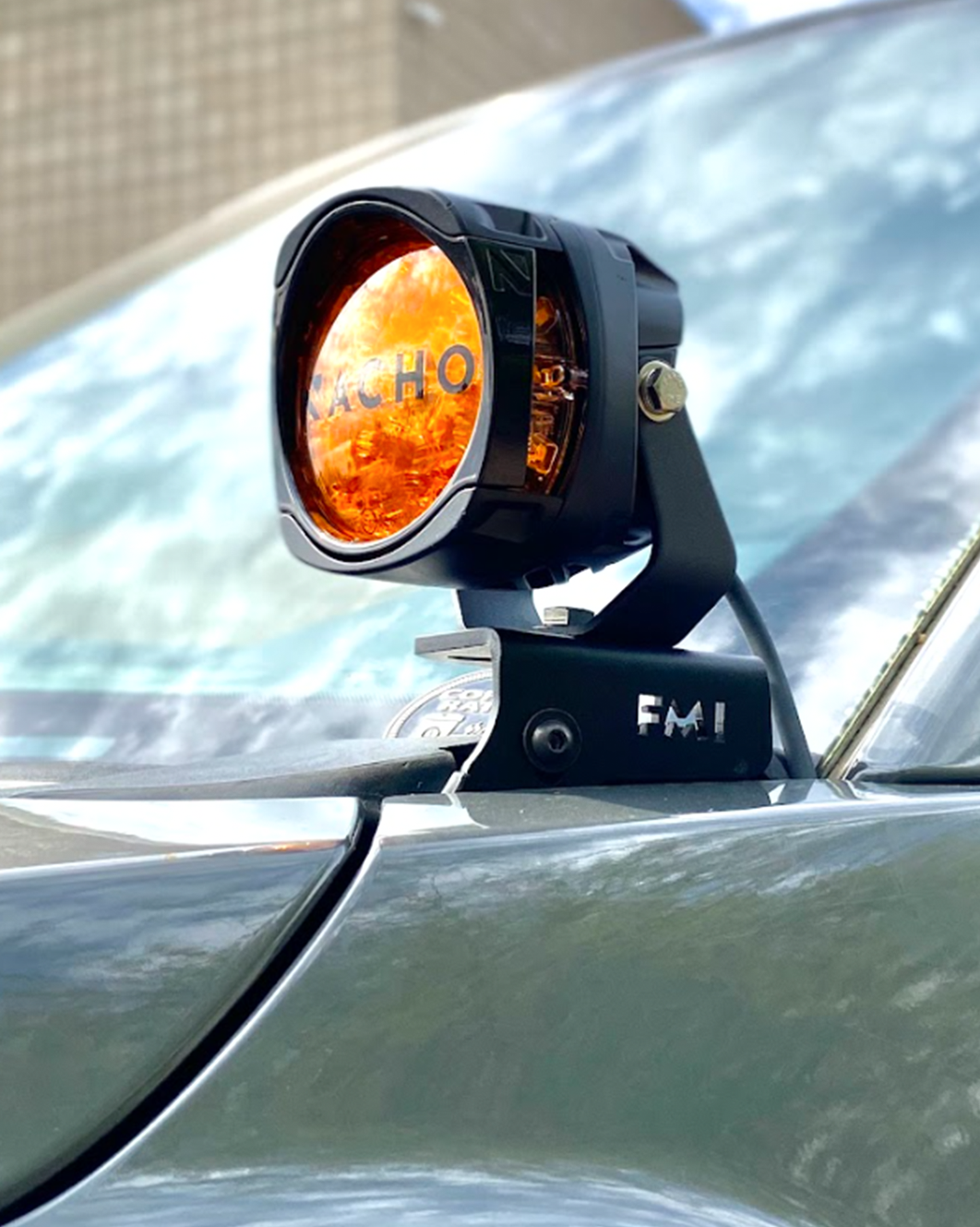 Front A-Pillar light mount kit for 2017-2020 Gen 2 Raptor, featuring an orange light for enhanced visibility.