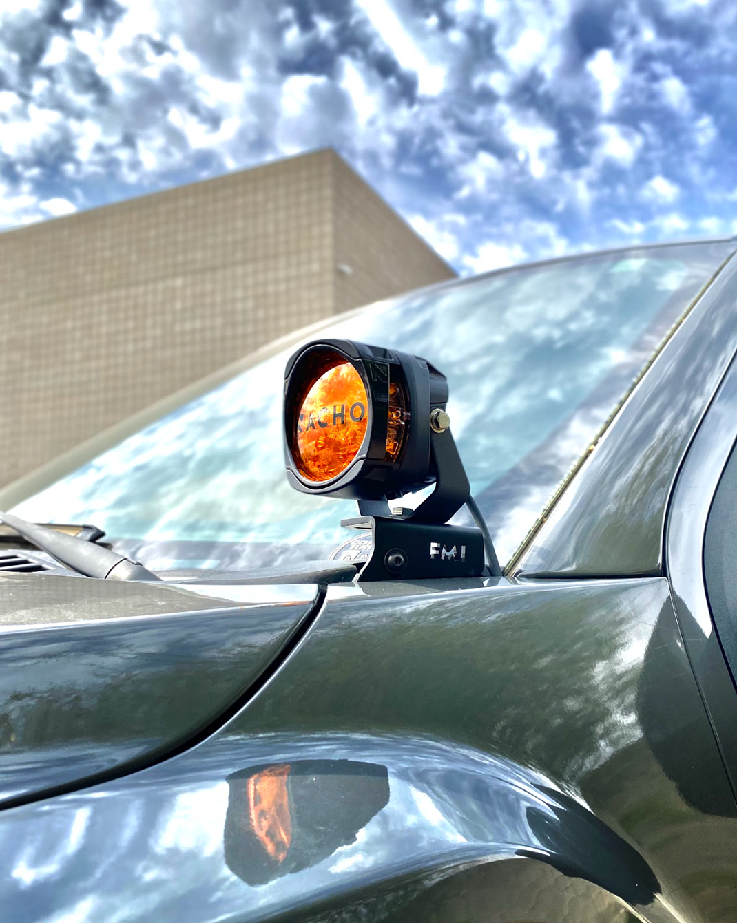 Front A-Pillar light mount kit for 2017-2020 Gen 2 Raptor, showcasing a mounted amber light on the vehicle.