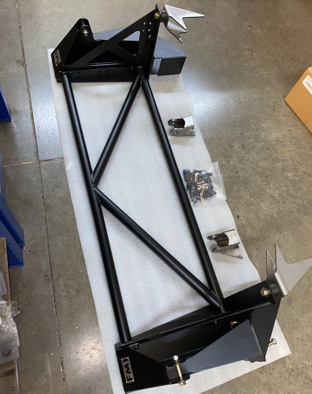 Rear bed cage shock tower for 2017-2020 Raptor, designed for 20.25-inch wheel travel, featuring a sturdy black steel frame.