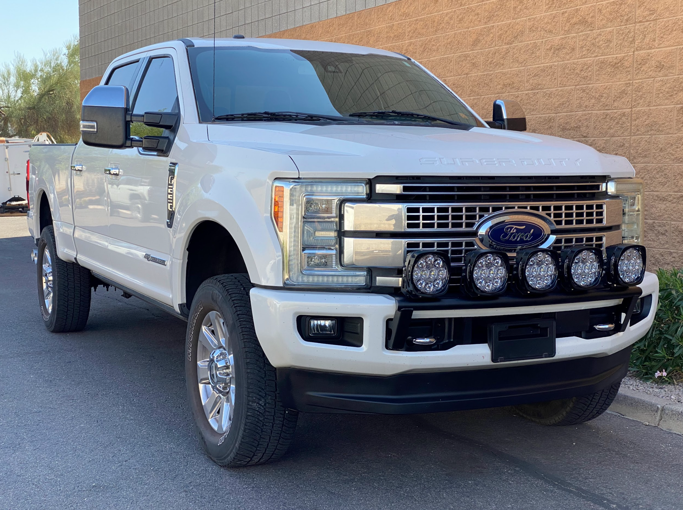 Front view of a 2017-2022 Ford F-250 Super Duty equipped with a light mount kit from Foutz Motorsports, showcasing off-road lights.