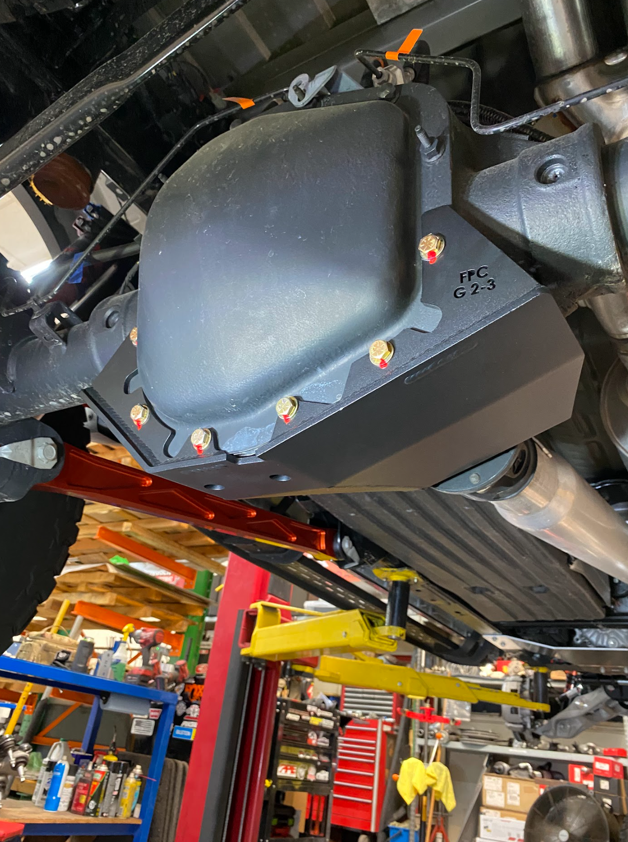 2017-2024 Raptor rear differential skid plate kit installed, showcasing durable protection for off-road performance.