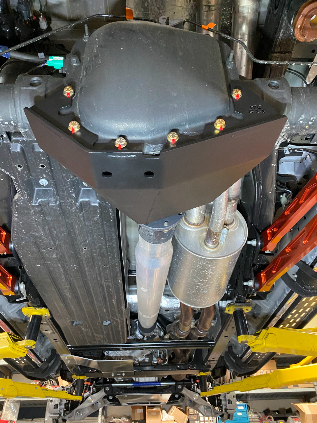 Rear differential skid plate kit for 2017-2024 Raptor, showcasing durable protection and installation under the vehicle.