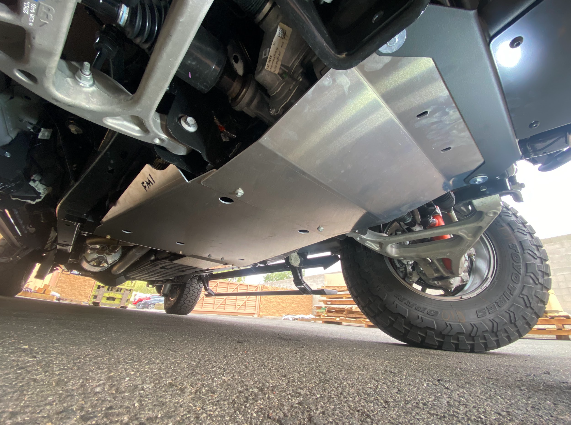 Skid plate kit for 2017-2024 Ford Raptor and Raptor-R, showcasing durable aluminum protection under the vehicle.