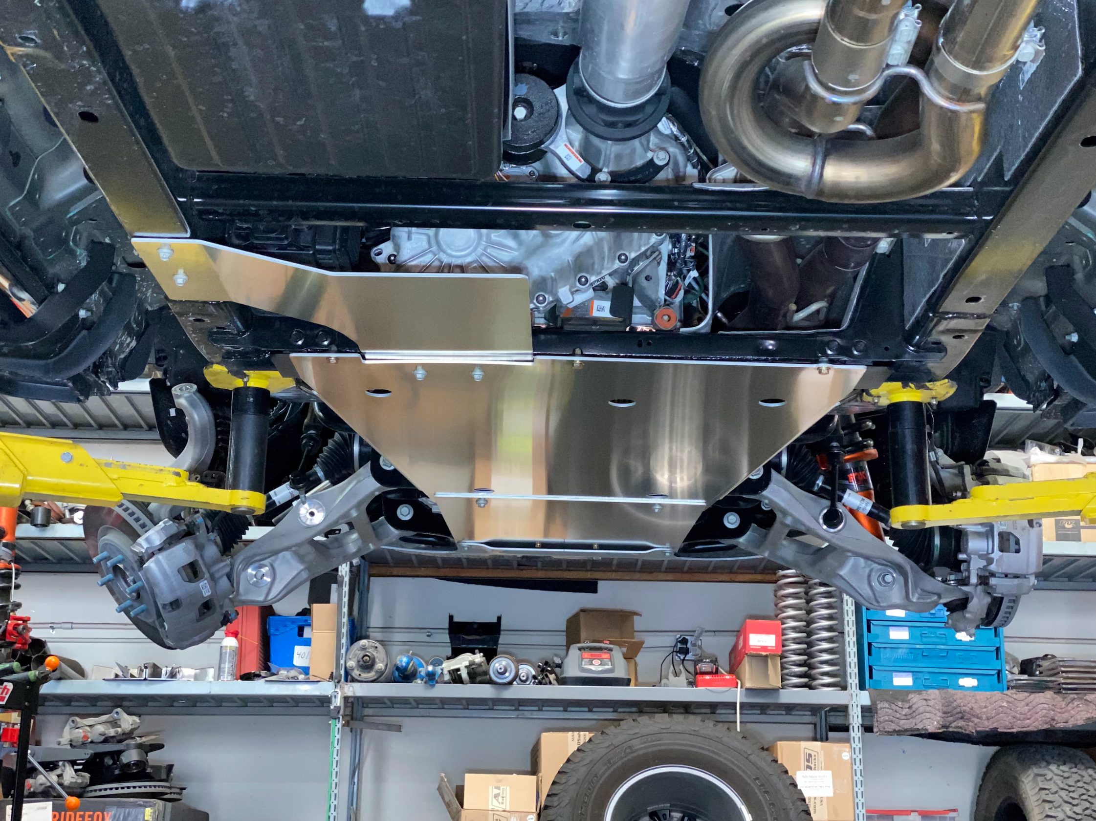 Skid plate kit installed on a 2017-2024 Ford Raptor, showcasing undercarriage protection and durability.