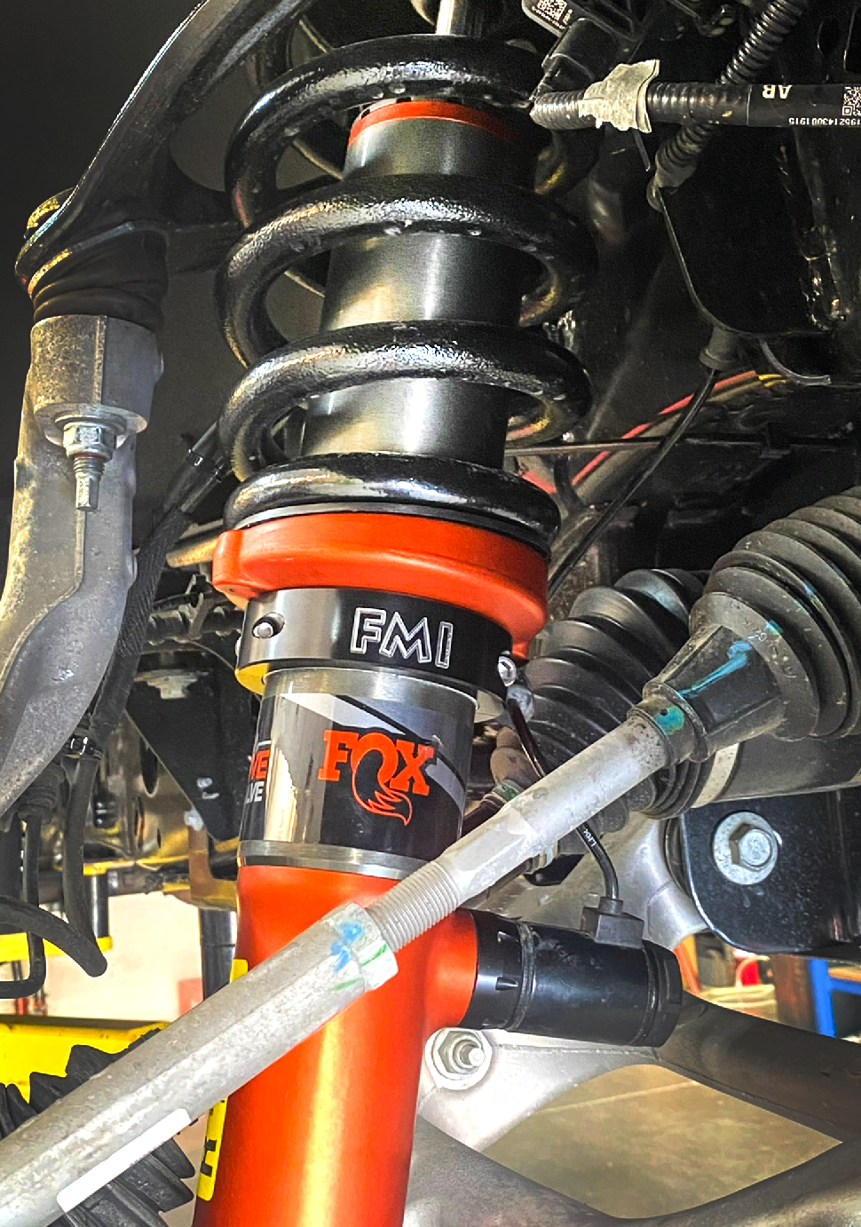 2021 and up Raptor front leveling kit featuring a Fox shock absorber and coil spring for a 1.5 or 2-inch lift.