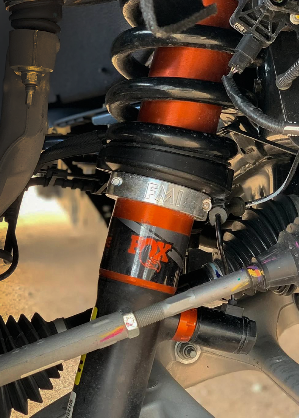2021 and up Raptor front leveling kit showcasing a 2 inch lift with FOX shocks and suspension components.