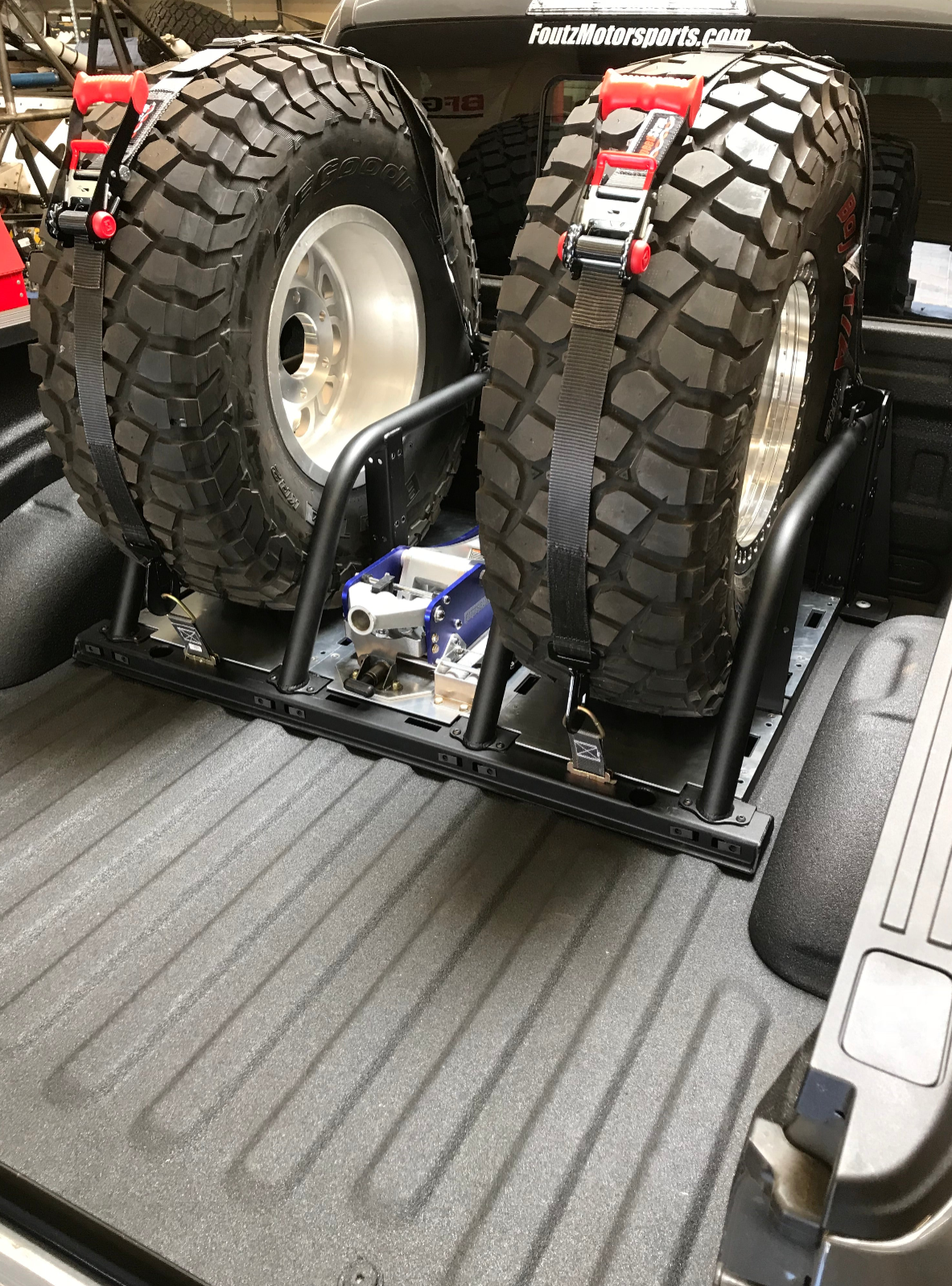 2021+ Raptor 5-Link Rear Bed Organizer designed for 3.0x16 coil over or 3.5x16 bypass shock, securely holds spare tires.