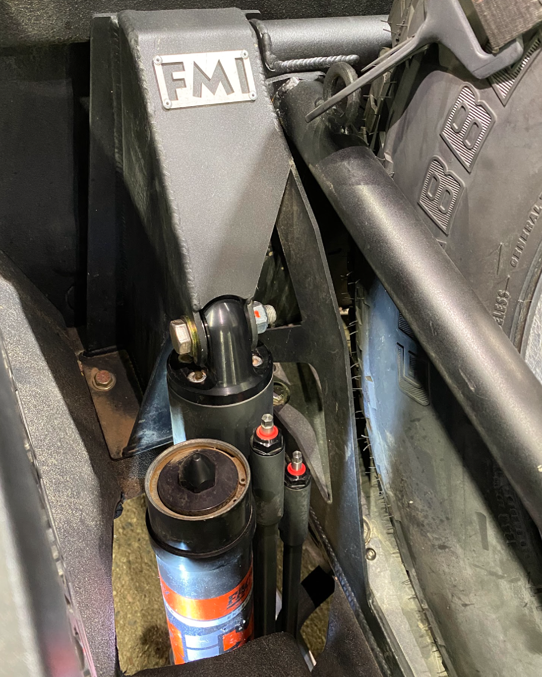 2021+ Raptor 5-Link Rear Bed Organizer with 3.0x16 Coil Over and 3.5x16 Bypass Shock for enhanced off-road performance.