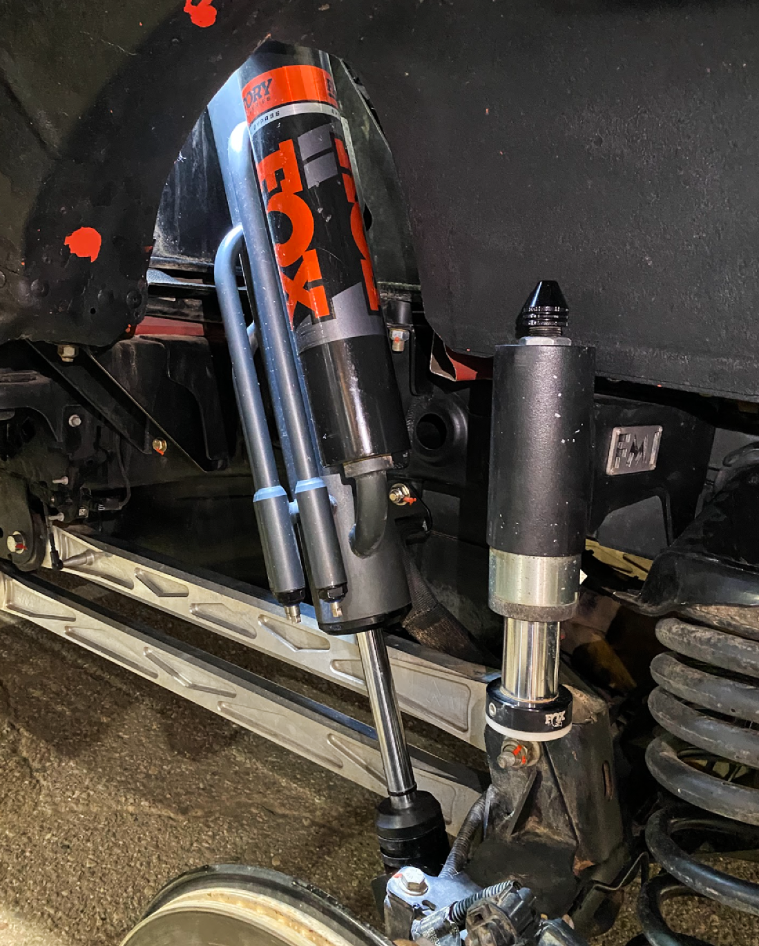 2021+ Raptor 5-Link Rear Bed Organizer with Fox 3.0x16 Coil Over and 3.5x16 Bypass Shock installed in a truck.