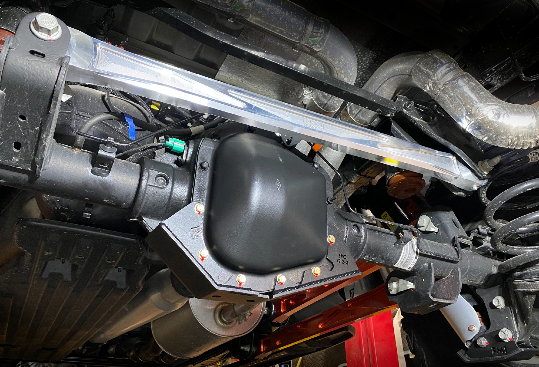 2021-2024 F150 Raptor billet panhard bar featuring an ultra-flex joint, showcasing durable construction for offroad performance.