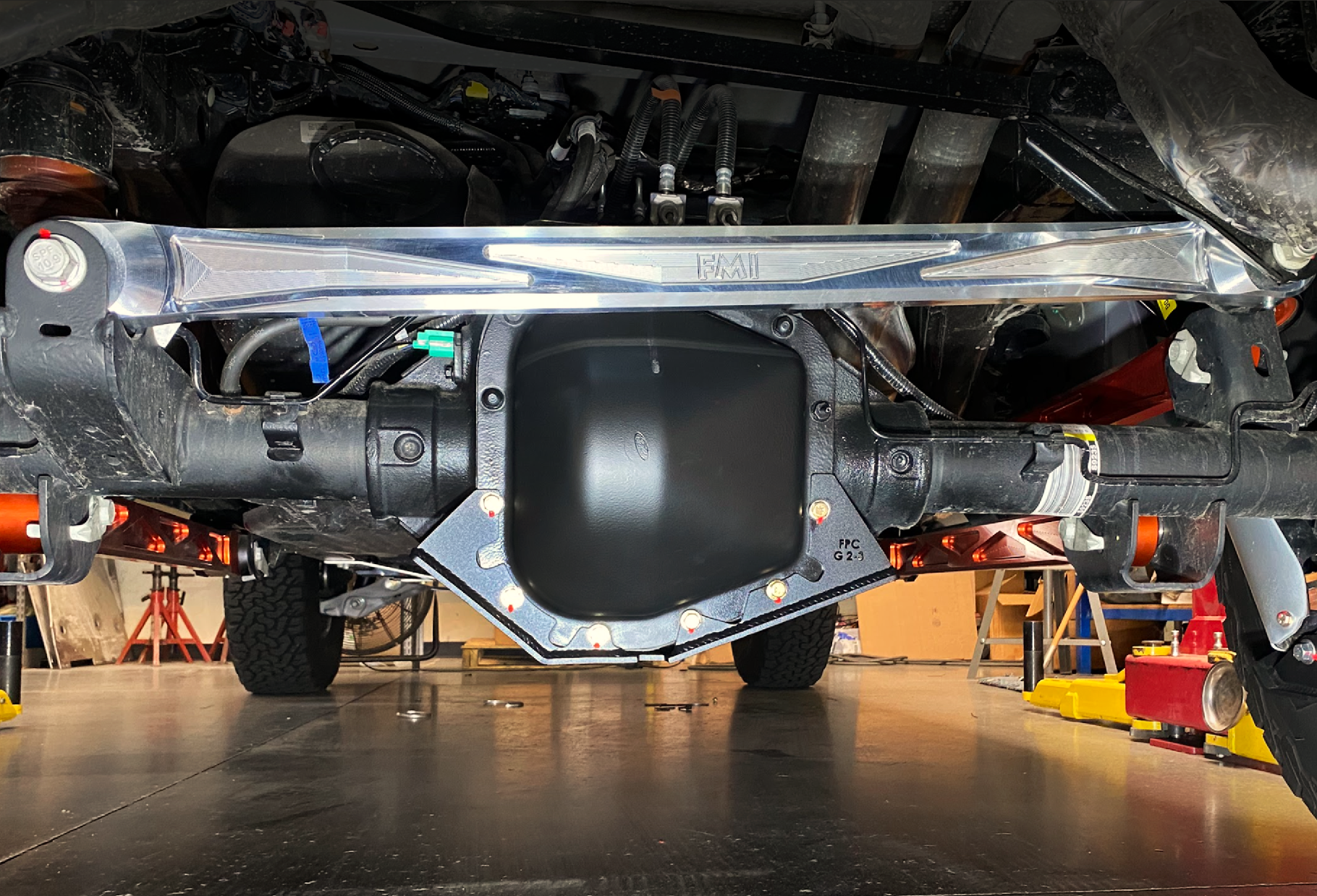 2021-2024 F150 Raptor billet panhard bar with ultra-flex joint installed, showcasing durable construction and performance features.