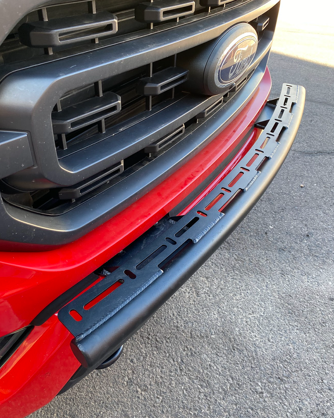 Front light mount for 2021-2023 Ford F150, designed for stock bumper installation, showcasing a sleek black finish.