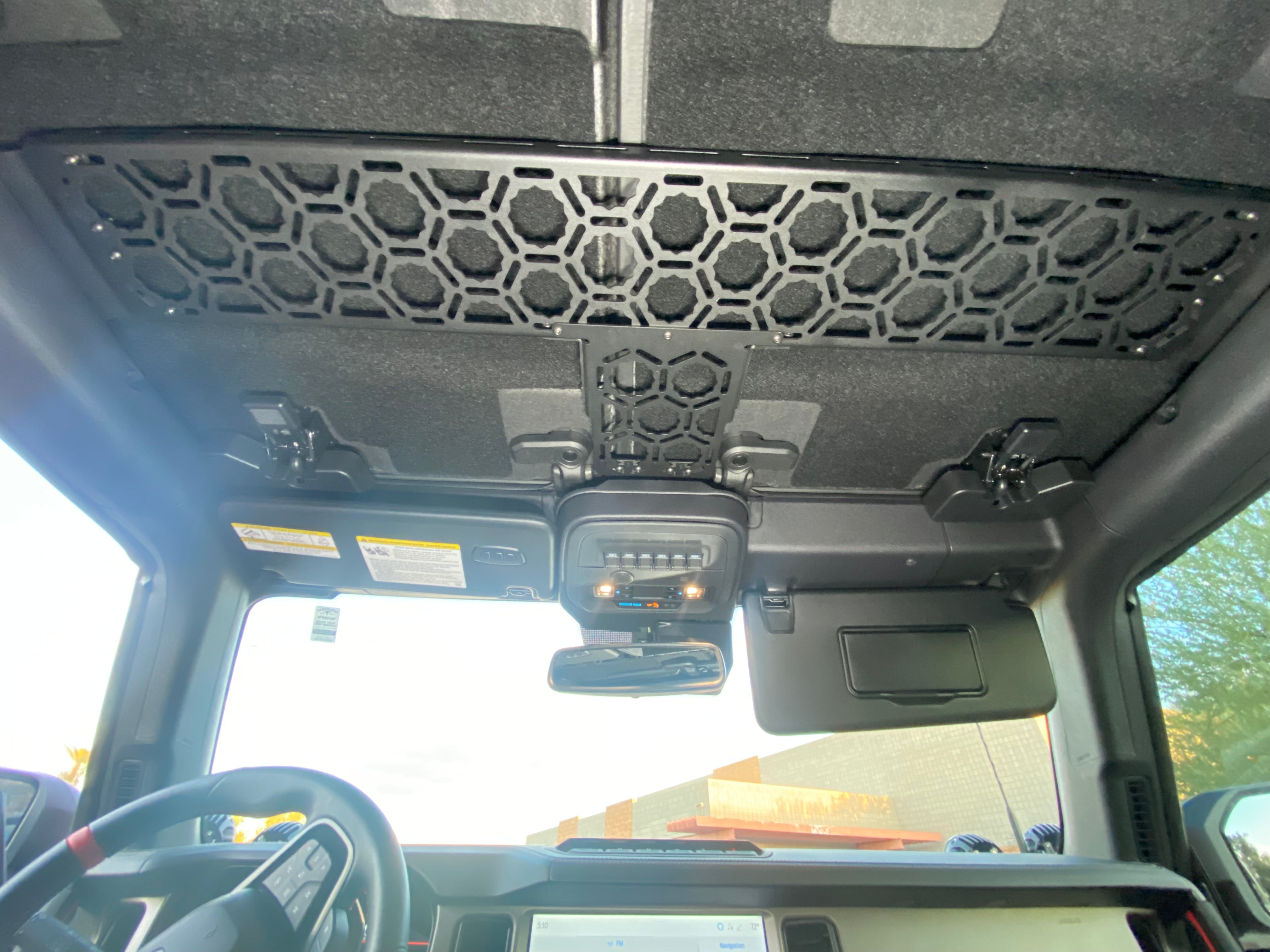 Interior view of a 2021 Bronco featuring an Adapt-A-Panel roof mount, designed for optimal storage and accessibility.