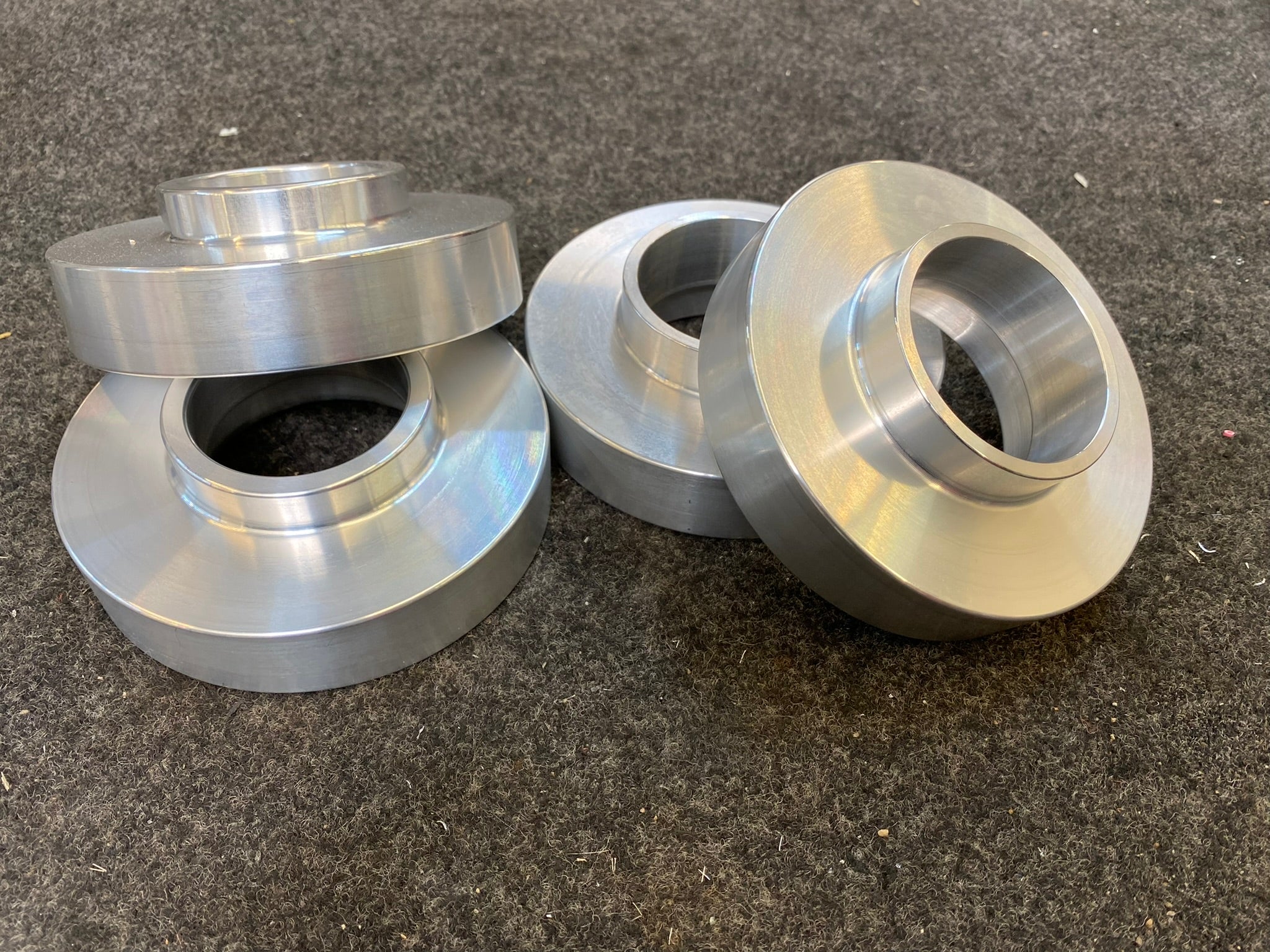 2021-2022 Bronco 1-inch front leveling kit components showcasing precision-machined aluminum spacers.