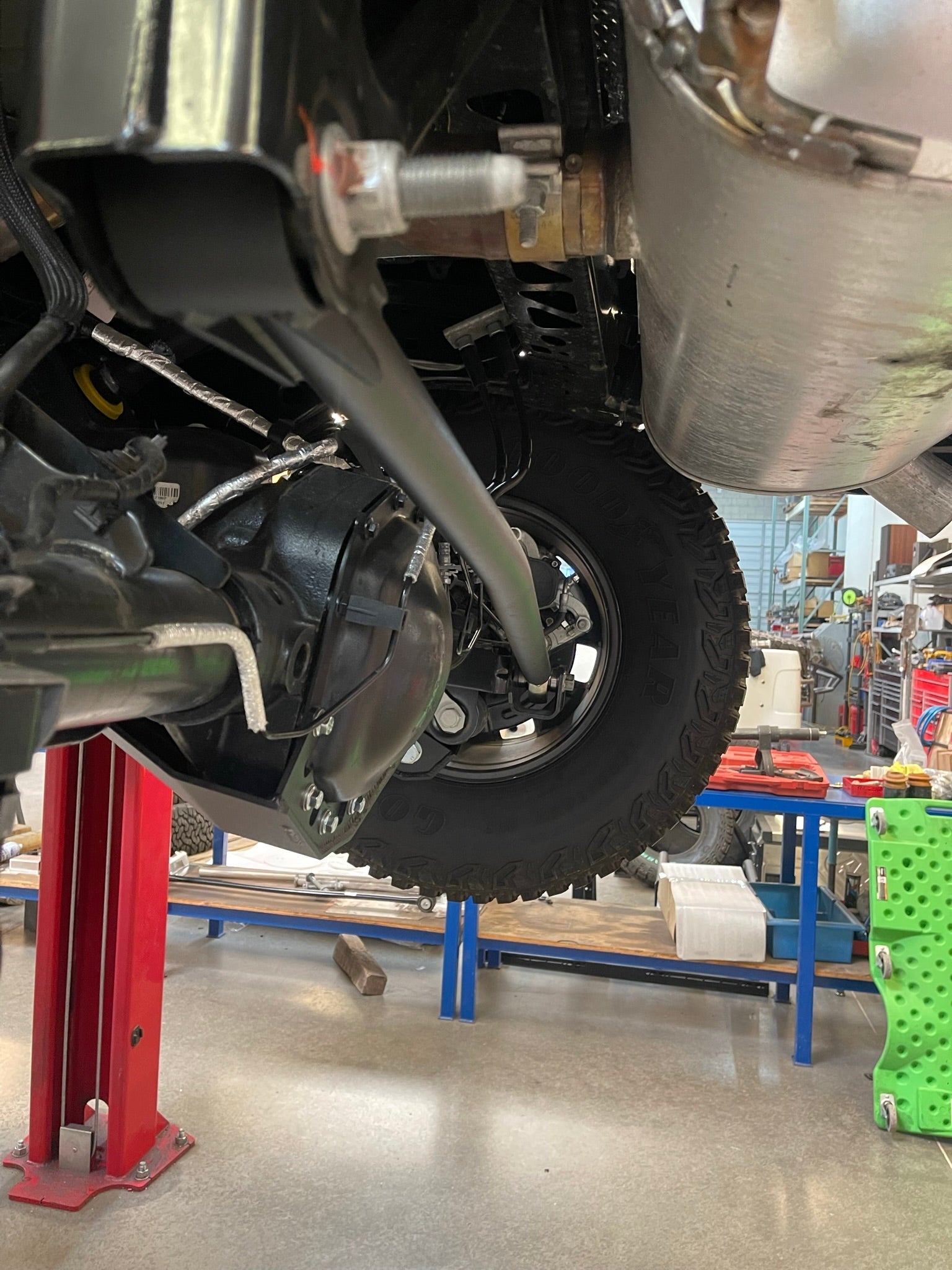 Adjustable panhard bar kit for 2022-UP Bronco Raptor, featuring heim joint design, installed under vehicle.